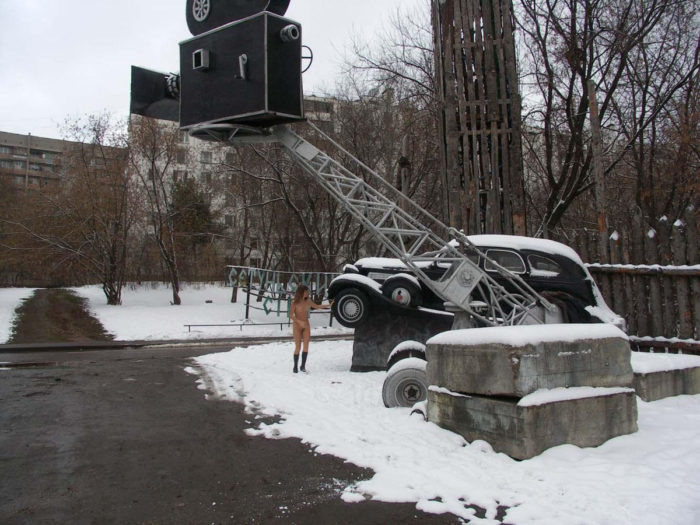 A girl who likes to walk naked in a snow-covered city