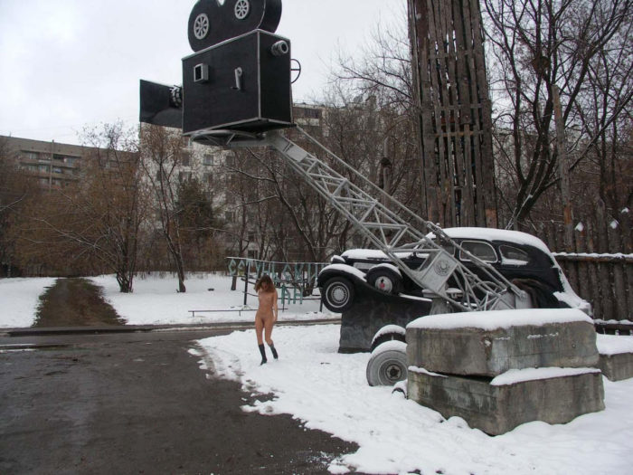 A girl who likes to walk naked in a snow-covered city