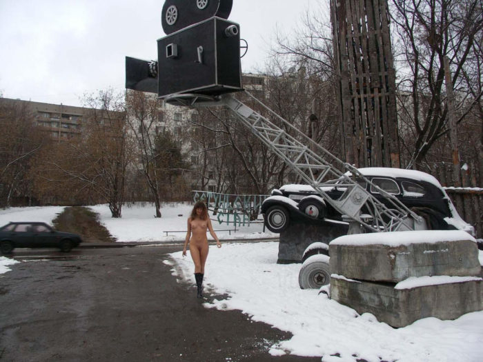 A girl who likes to walk naked in a snow-covered city