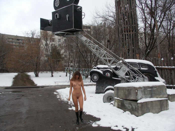 A girl who likes to walk naked in a snow-covered city