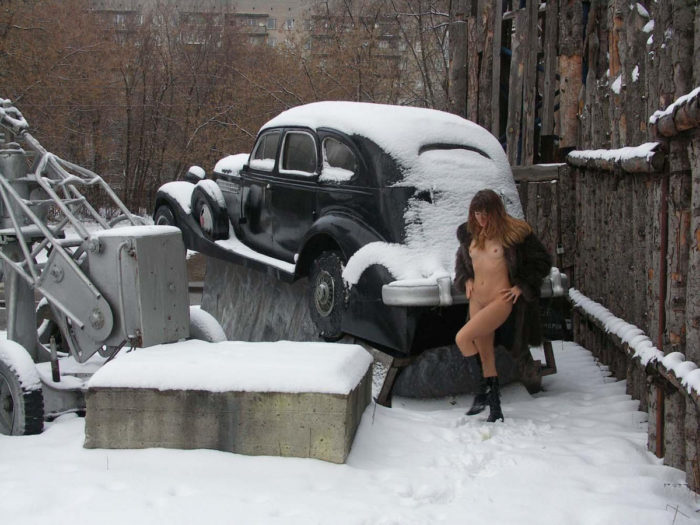 A girl who likes to walk naked in a snow-covered city