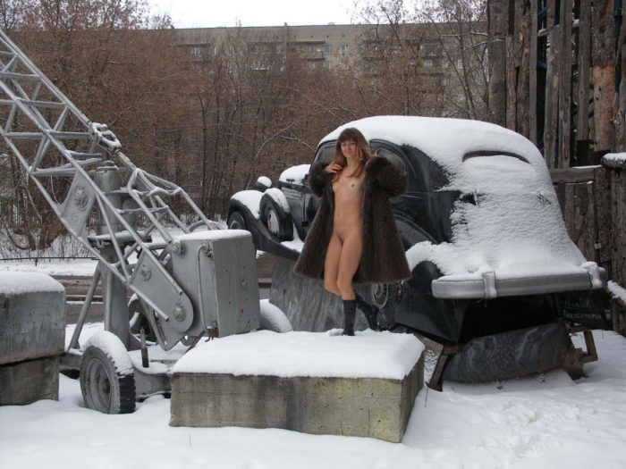 A girl who likes to walk naked in a snow-covered city