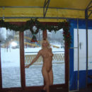 Blonde girl Loli in winter park
