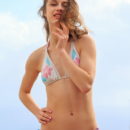 Clarice shows off her beautiful ass and pink pussy outdoors.