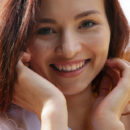 Berenice stpreads her legs wide open as she displays her sweet pussy outdoors.