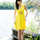 Brunette Zelda B posing in yellow dress