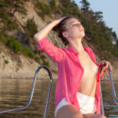 Gorgeous Shelby displays her sexy body as she poses sensually on the yacht.