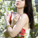 Like a gorgeous woodland nymph, Sivilla’s beauty and feminine allure stands out against the flowers and trees around her.