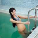 Loreen bares her slender body with beautiful breasts and meaty labia all over the pool.
