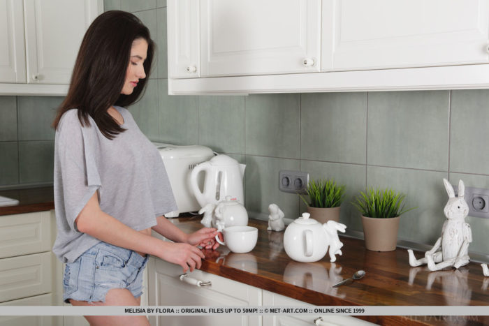 Newcomer Melisia strips in the kitchen as she displays her sweet, pink pussy.