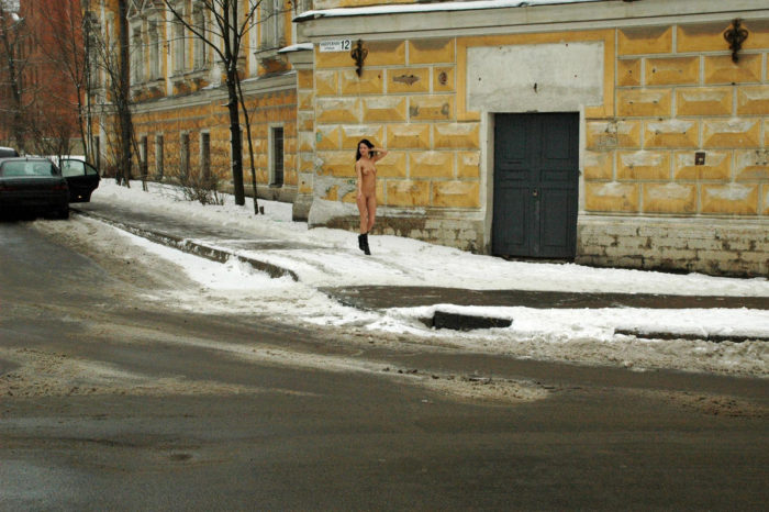 Russian amateur brunette Krista walks at winter streets with no clothes