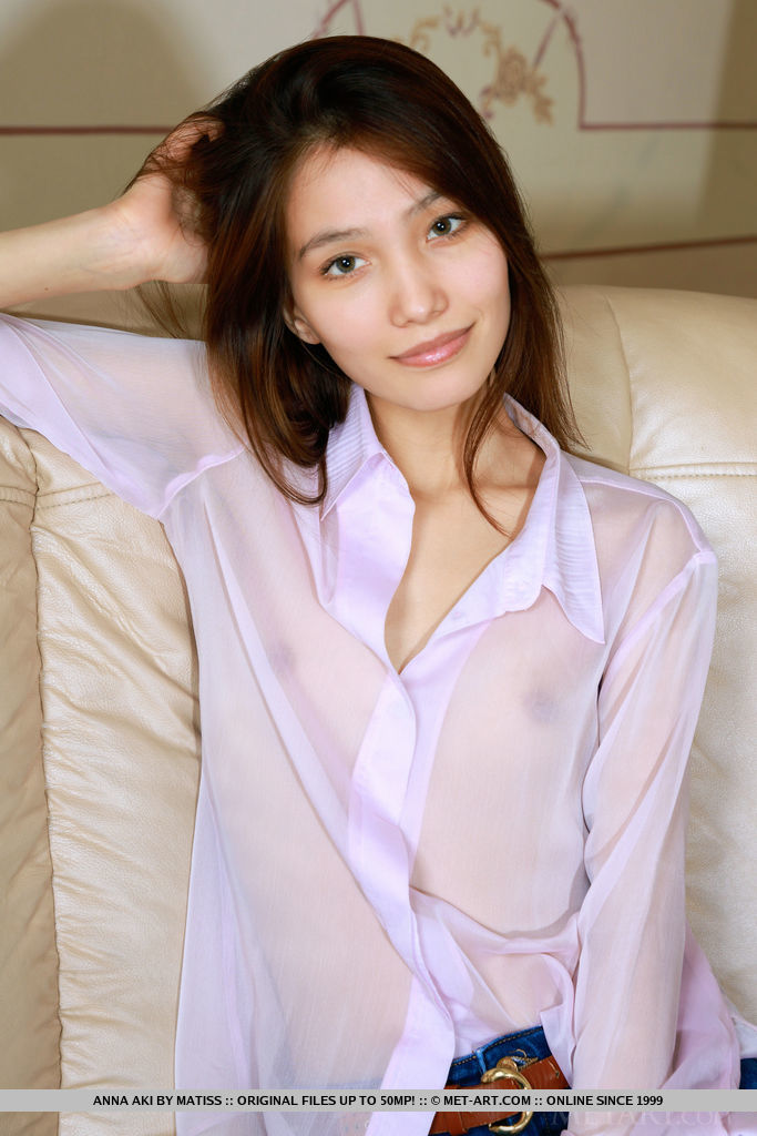 Anna Aki strip her long sleeves and jeans on the couch baring her slim body.