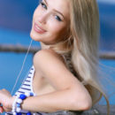 Genevieve Gandi basks under the sun showcasing her sexy body with creamy white as she performs erotic, wide open poses.