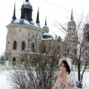 Russian brunette posing naked by the curch