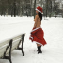 Brunette in Santa Clause dress at winter park