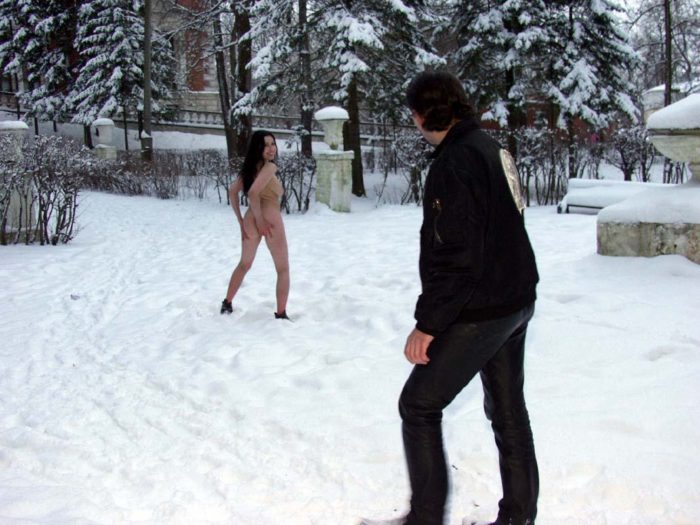 Naked brunette posing at winter park