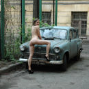Russian teen on an old car
