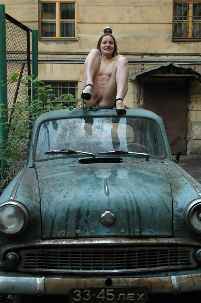 Russian teen on an old car