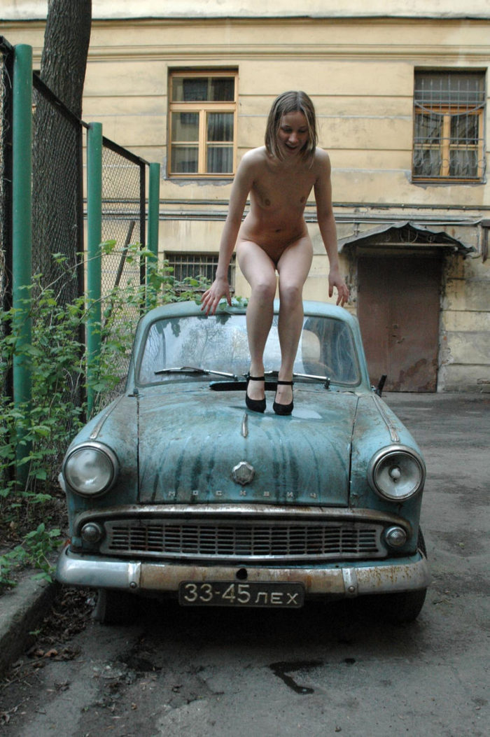 Russian teen on an old car