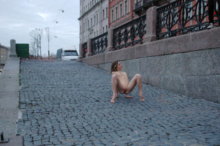 Young russian babe exposes her sweet pussy at morning street