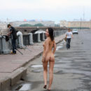 Naked girl walks next to the fishermen