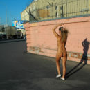 Shameless blonde with no clothes at streets