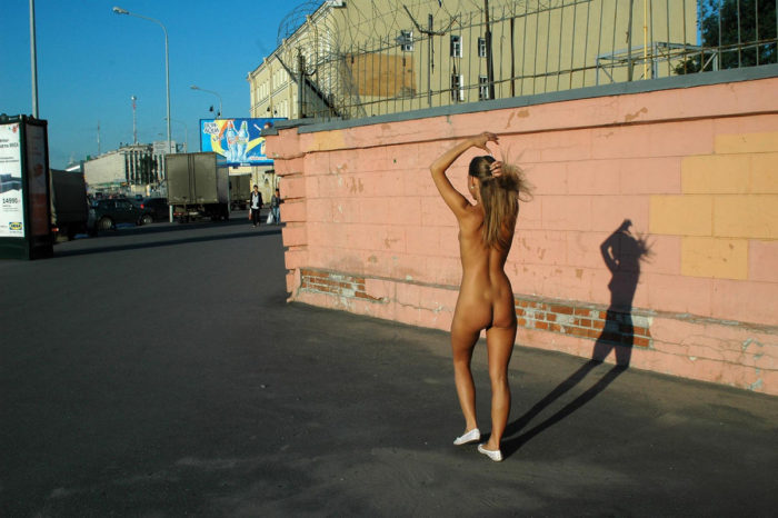 Shameless blonde with no clothes at streets