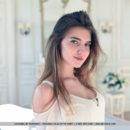 Top model Caramel flaunts her tight body as she strips on the sofa.