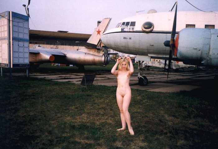 Blonde Elza with no clothes at airplane museum