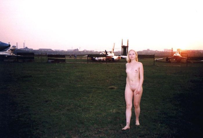 Blonde Elza with no clothes at airplane museum