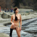 Huge-titted babe with a pigtail on the coast