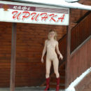 Naked blonde Natasha K at a roadside cafe