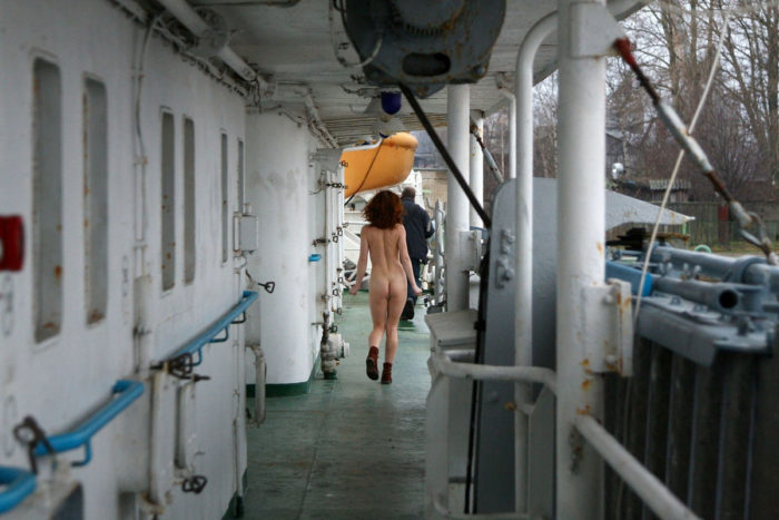 Naked redhead girl Masha on big ship