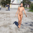 Naked teen Taissia A posing with strangers at street