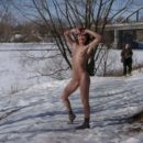 Redheaded girl Sabiria with a stranger at winter park