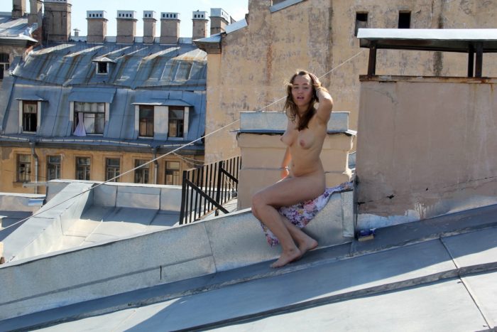 Russian teen with soft boobs smokes on the roof