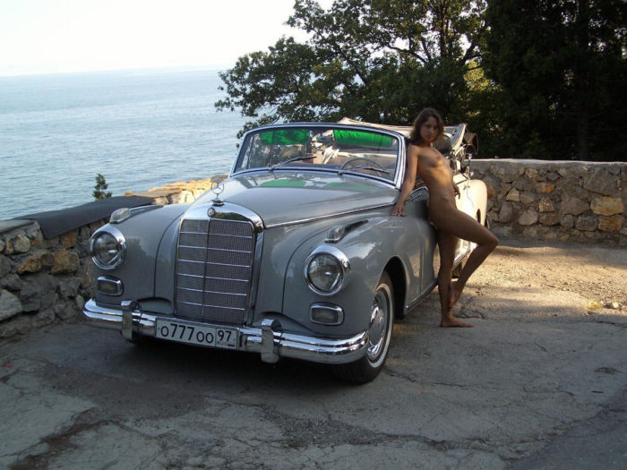Sexy russian teen posing near old Mercedes Benz