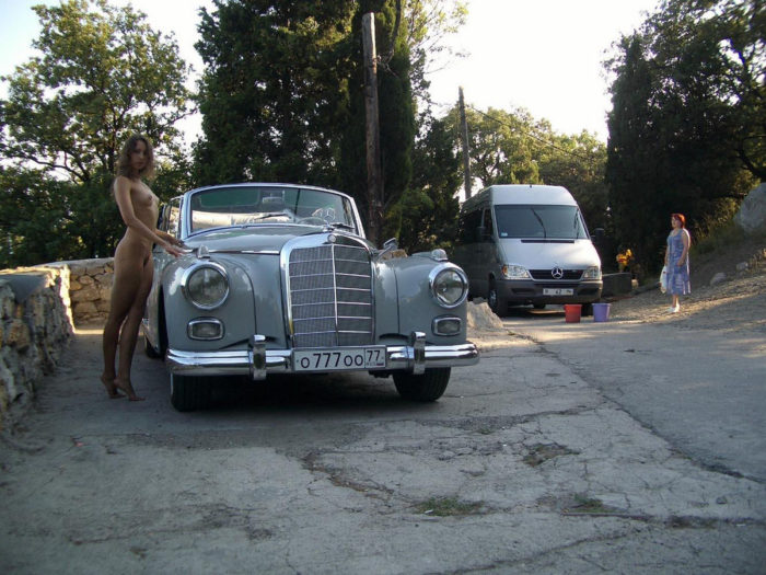 Sexy russian teen posing near old Mercedes Benz