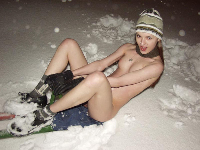 Slender girl on a snow-covered playground