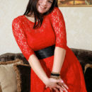 Sofia H shows off her luscious body and smooth pussy as she strips on the couch.