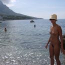 Teen Ulia with sporty body at public not-nude beach