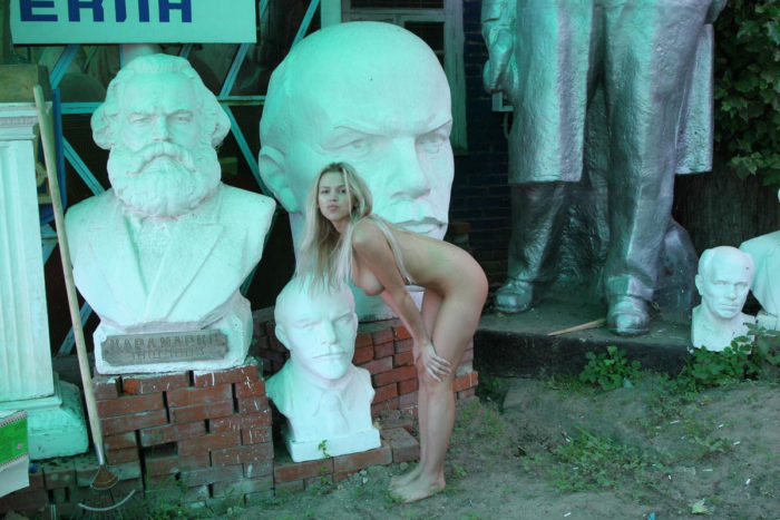 Busty blonde Olga G posing in sculpture store