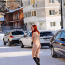 Busty redhead with perfect body at winter streets