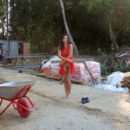 Busty teen brunette helps workers at construction site