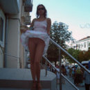 Girl in white skirt flashes her pussy at public