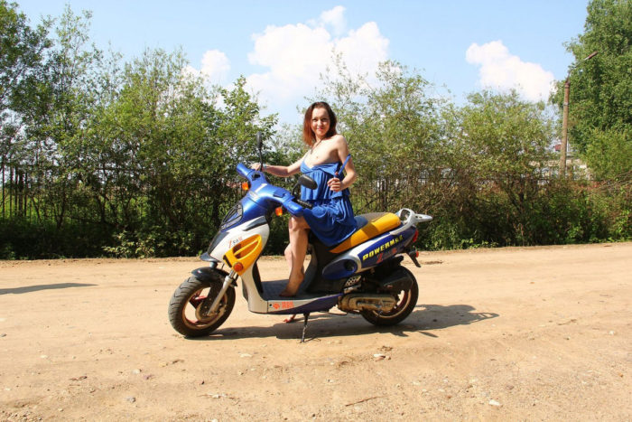 Naked girl Tamara D spreads legs on motorcycle