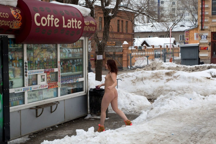 Redhead girl with big ass drinks some coffee at winter streets
