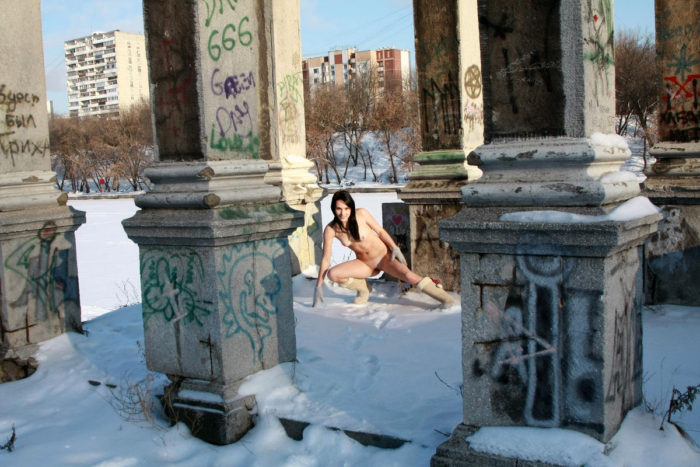 Sexy brunette Marina M near a frozen river