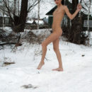 Skinny brunette Toma doggy pose in snow