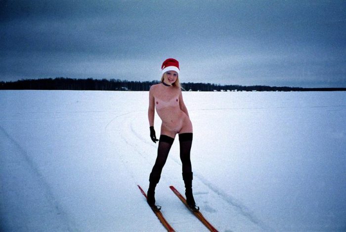 Smiling blonde in stockings on skis!